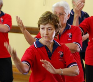 Close up of people practicing Tai Chi