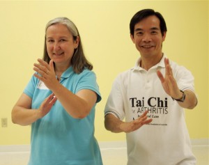 Close up of two people practicing Tai Chi